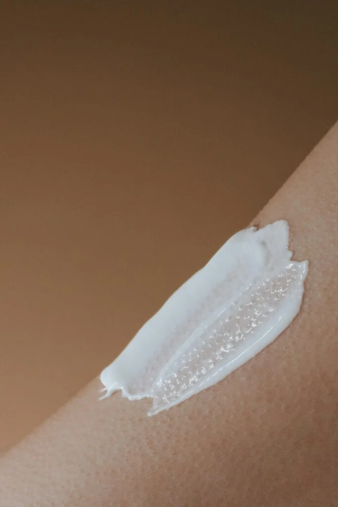 White cream spread on the skin of an arm.