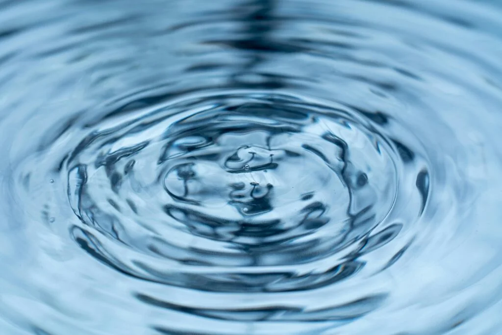 Concentric ripples on the surface of water.