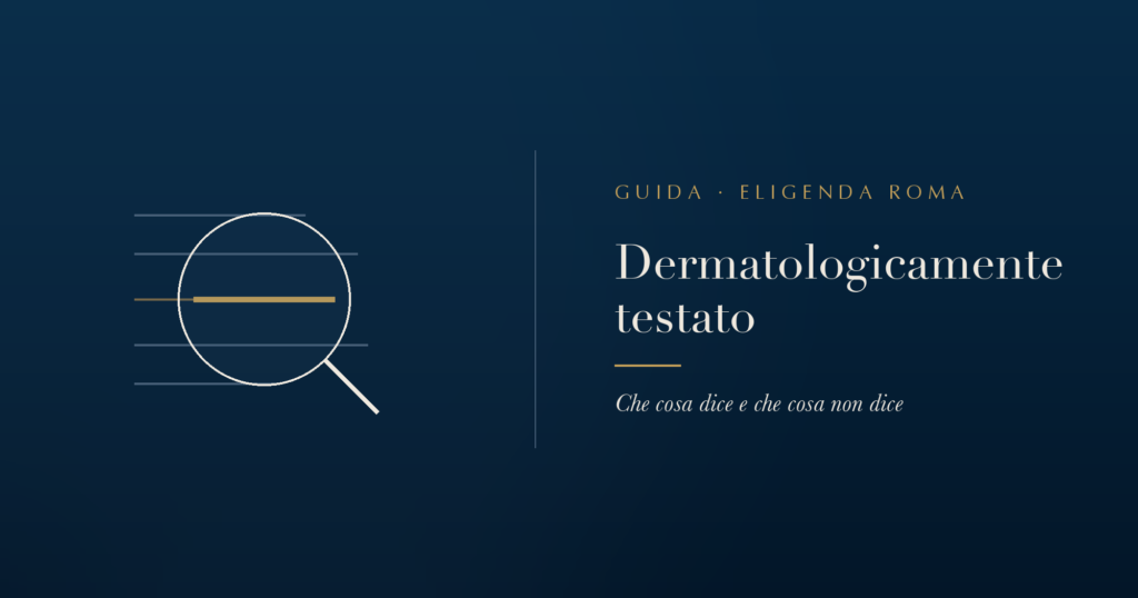 Una lente di ingrandimento su una riga di testo in etichetta, con la dicitura dermatologicamente testato evidenziata in oro